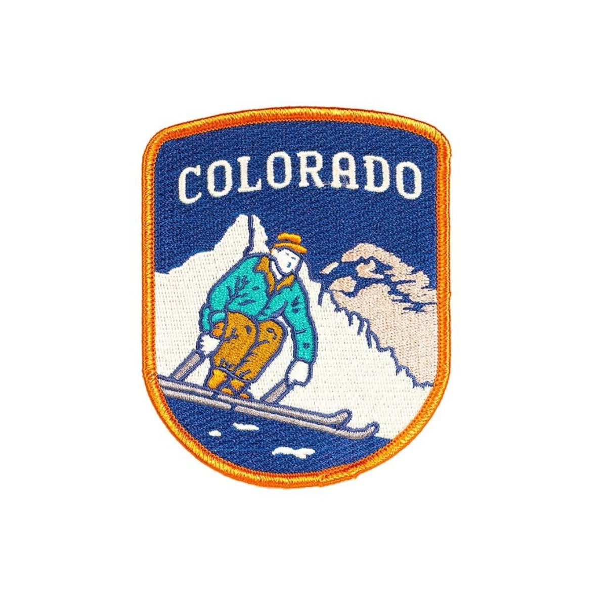 Embroidered patch with a skier and mountains, featuring the word 'Colorado'.