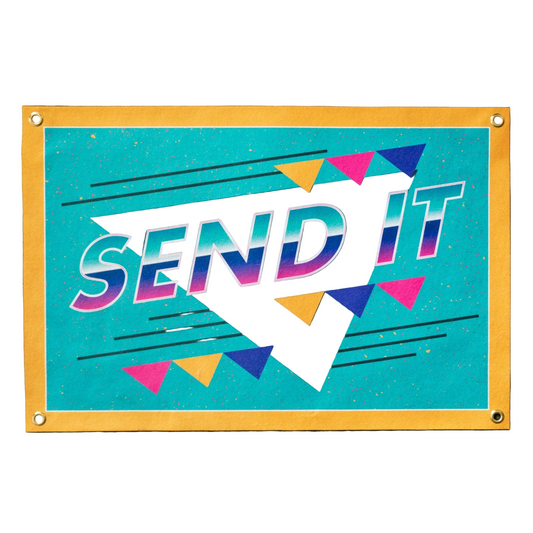 Colorful sign with 'SEND IT' text on a blue background