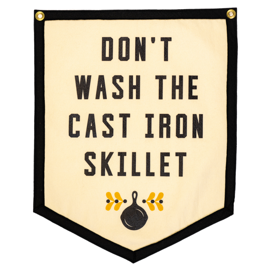Decorative banner with text 'Don't wash the cast iron skillet' on a beige background.