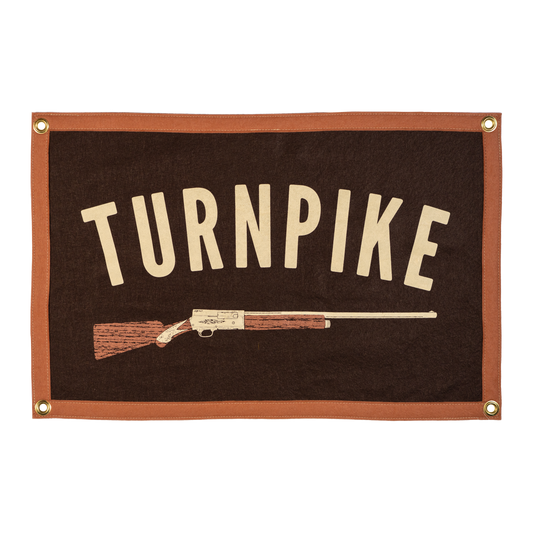 Banner with 'TURNPIKE' text and a rifle illustration on a brown background