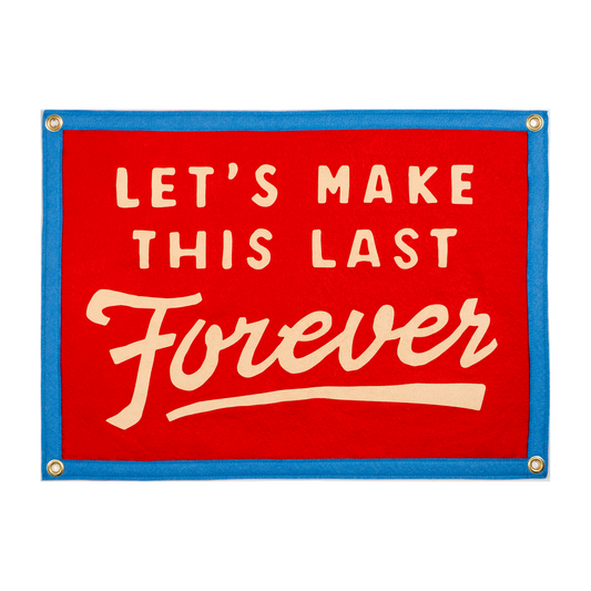 Red sign with white text 'LET'S MAKE THIS LAST Forever' and a blue border.